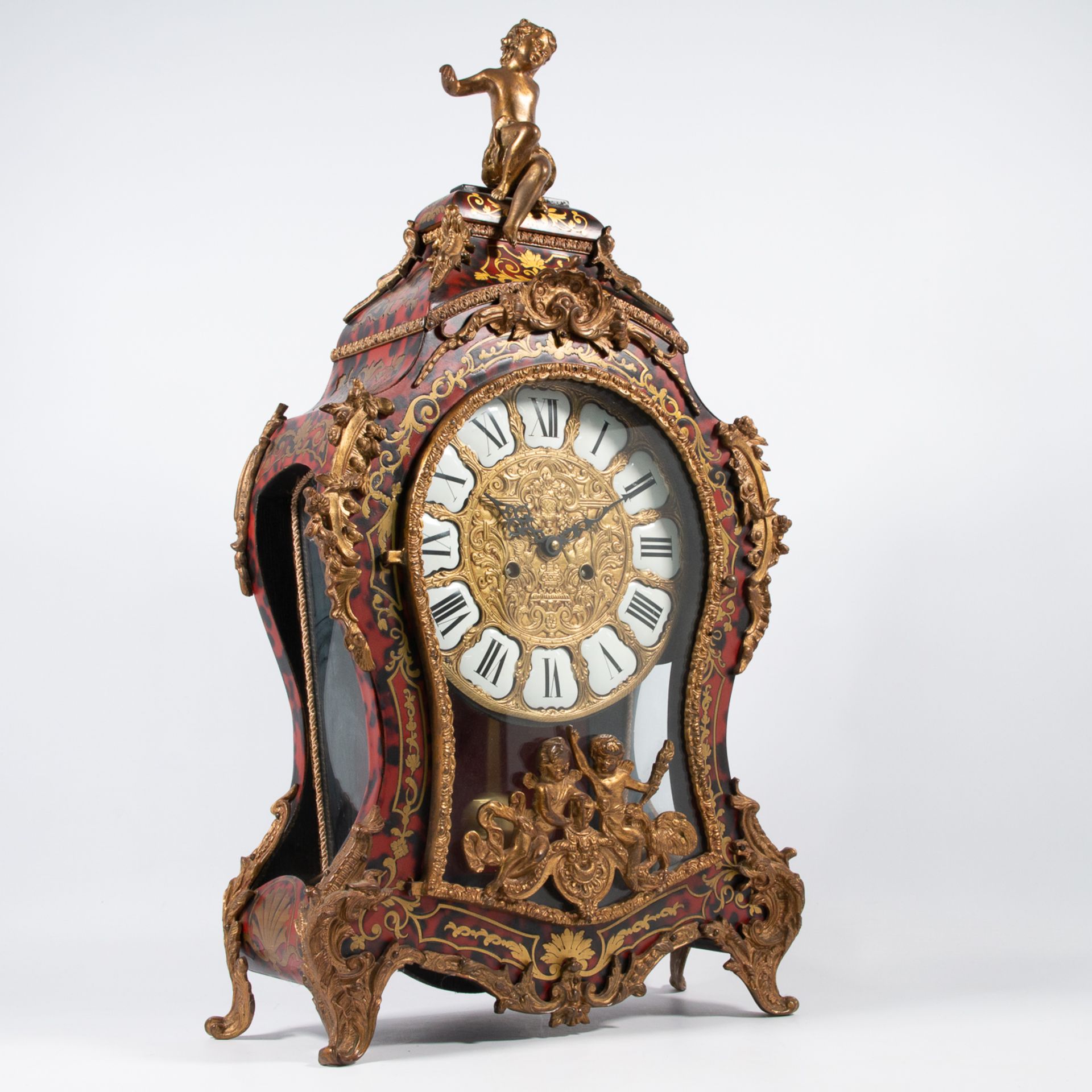 A Large cartel clock, finished with boulle and bronze. Germany during the second half of the 20th ce
