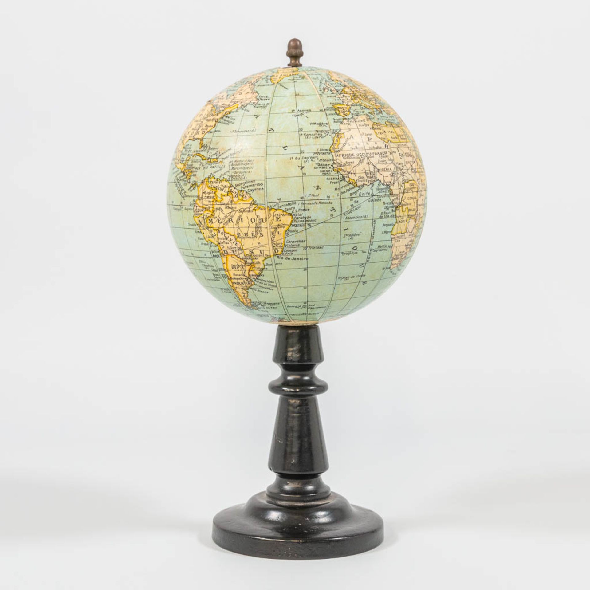 G. Thomas, Paris, A small globe on a wood base.