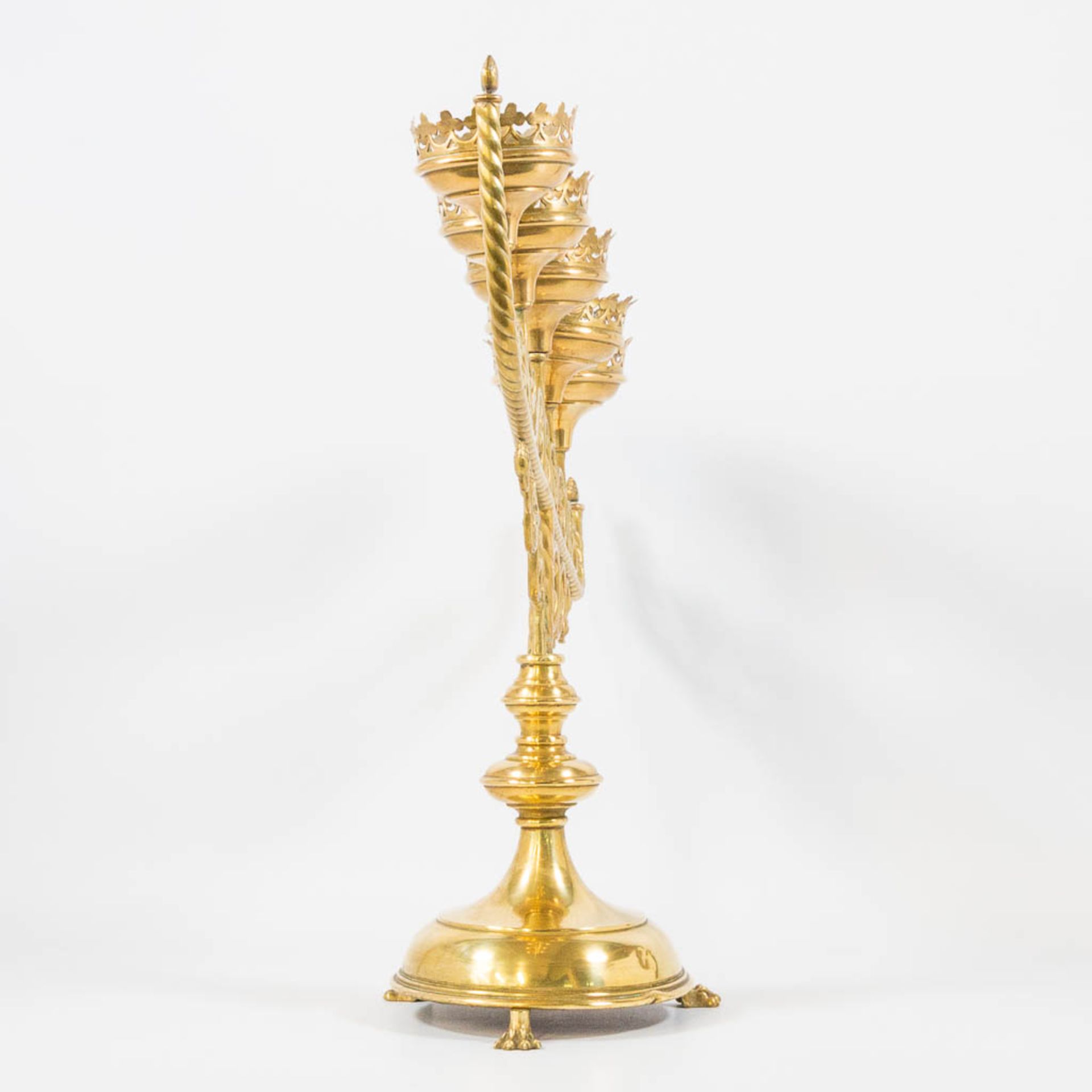 An Antique brass church candelabra, decorated with grape vine leaves and standing on claw feet, Fran - Image 2 of 22