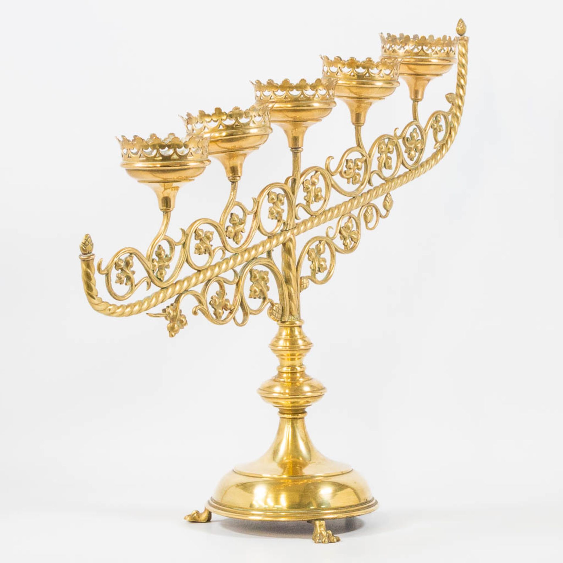 An Antique brass church candelabra, decorated with grape vine leaves and standing on claw feet, Fran - Image 15 of 22