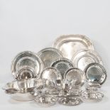 A collection of silver-plated trophies, plates, and objects.