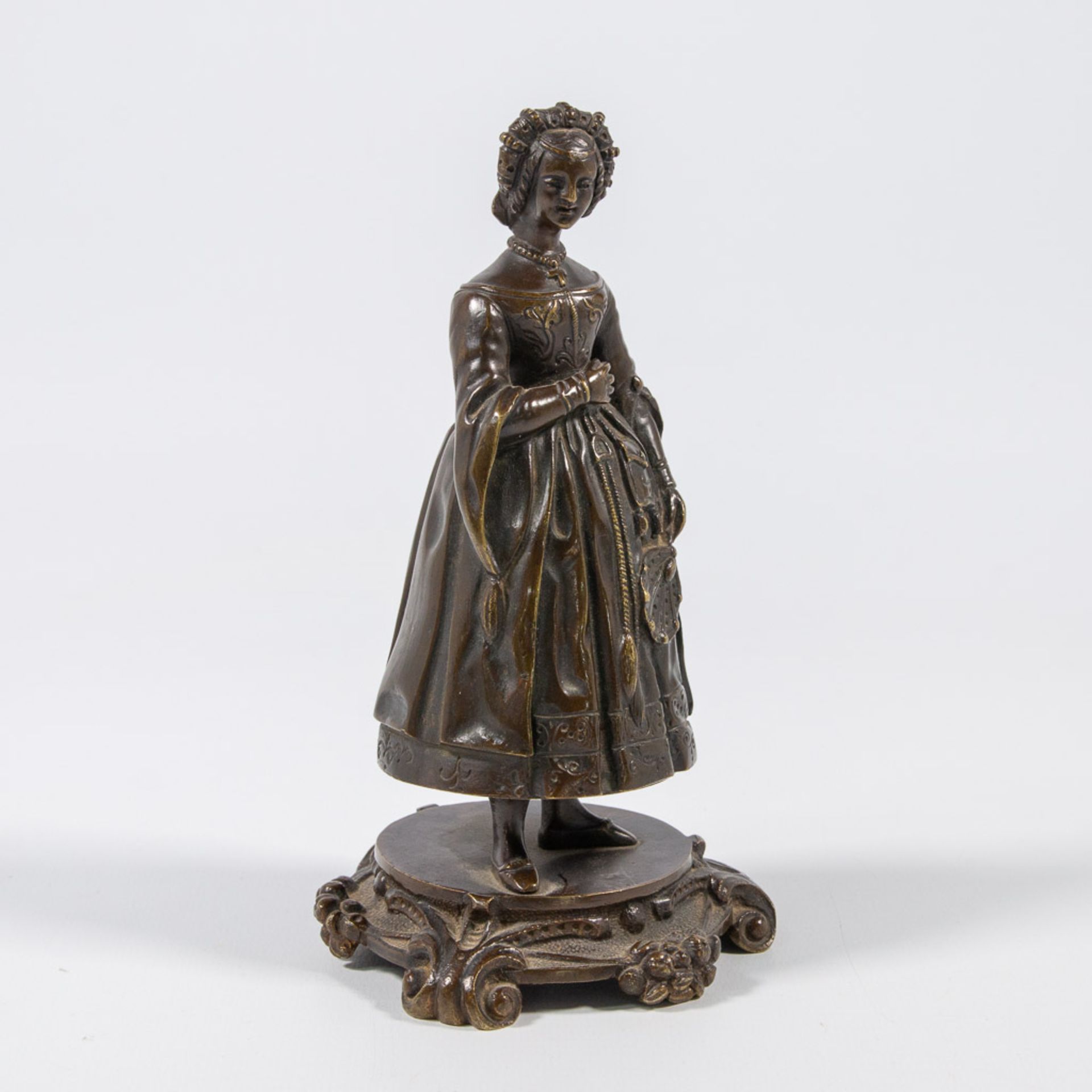 A figural bronze table bell, displayed as a lady with robe. - Bild 3 aus 21