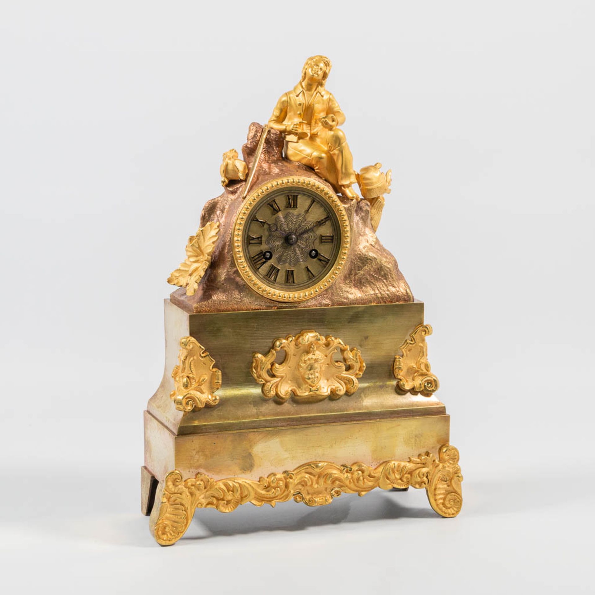 An Ormolu Bronze Mantle Clock with Romantic Scene