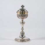 An antique, silver ciborium.