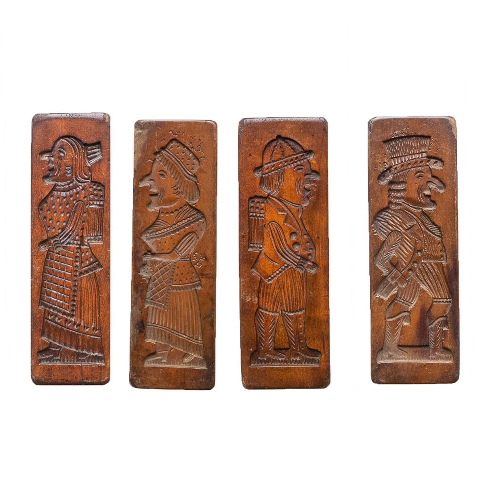 A collection of 4 wood cookies or gingerbread moulds/molds.