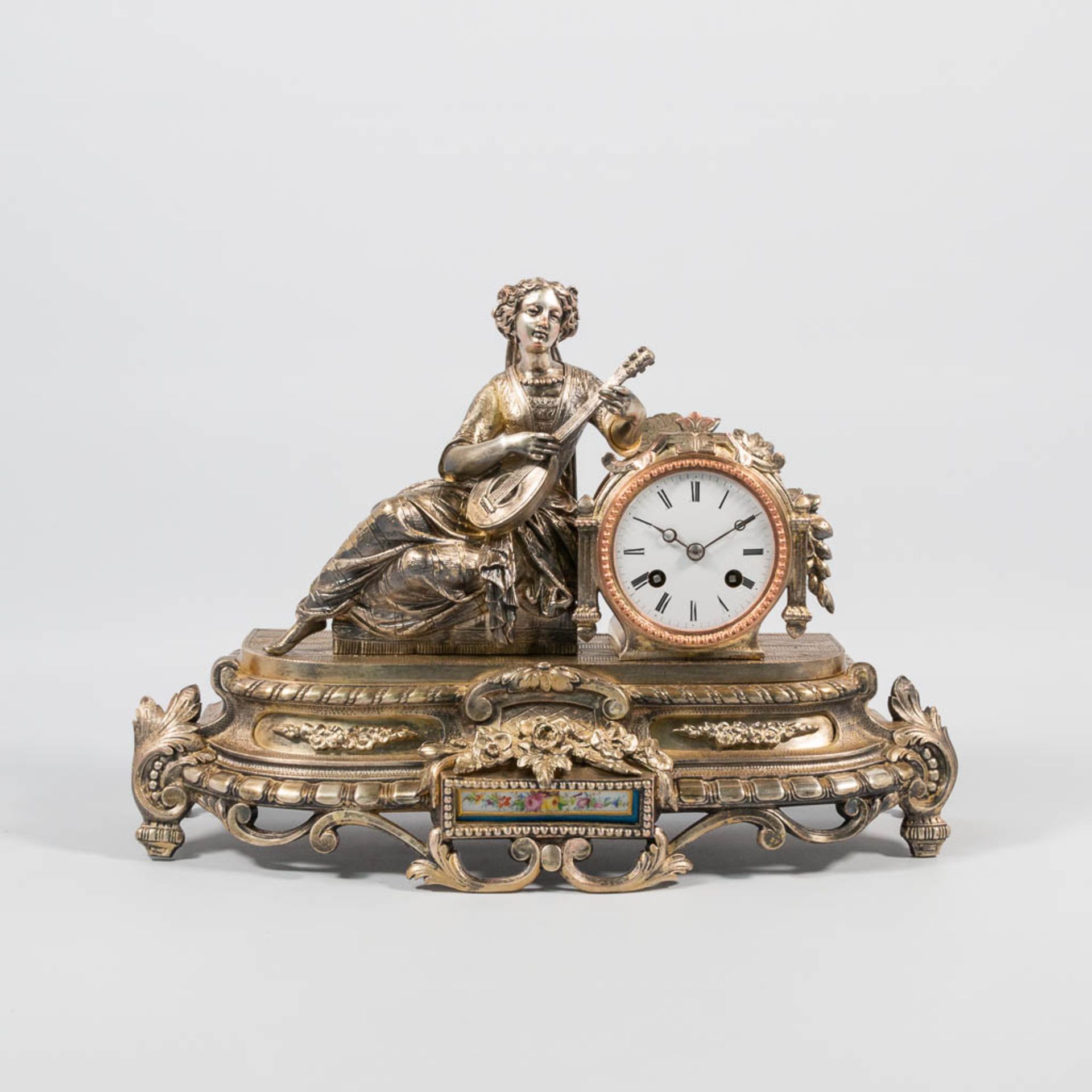 A Mantle clock with Romantic Scene, Silver plated Bronze.