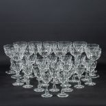 A collection of 34 antique cyrstal glasses with cut sides.