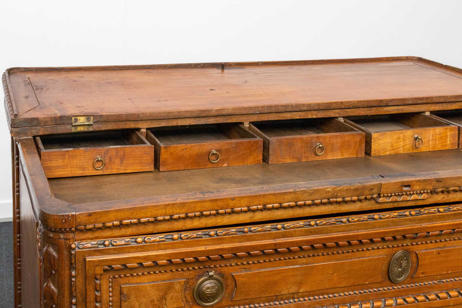 A wood sculptured commode in Louis XVI style, with 3 drawers and a hidden desk. 18th century. - Image 13 of 23