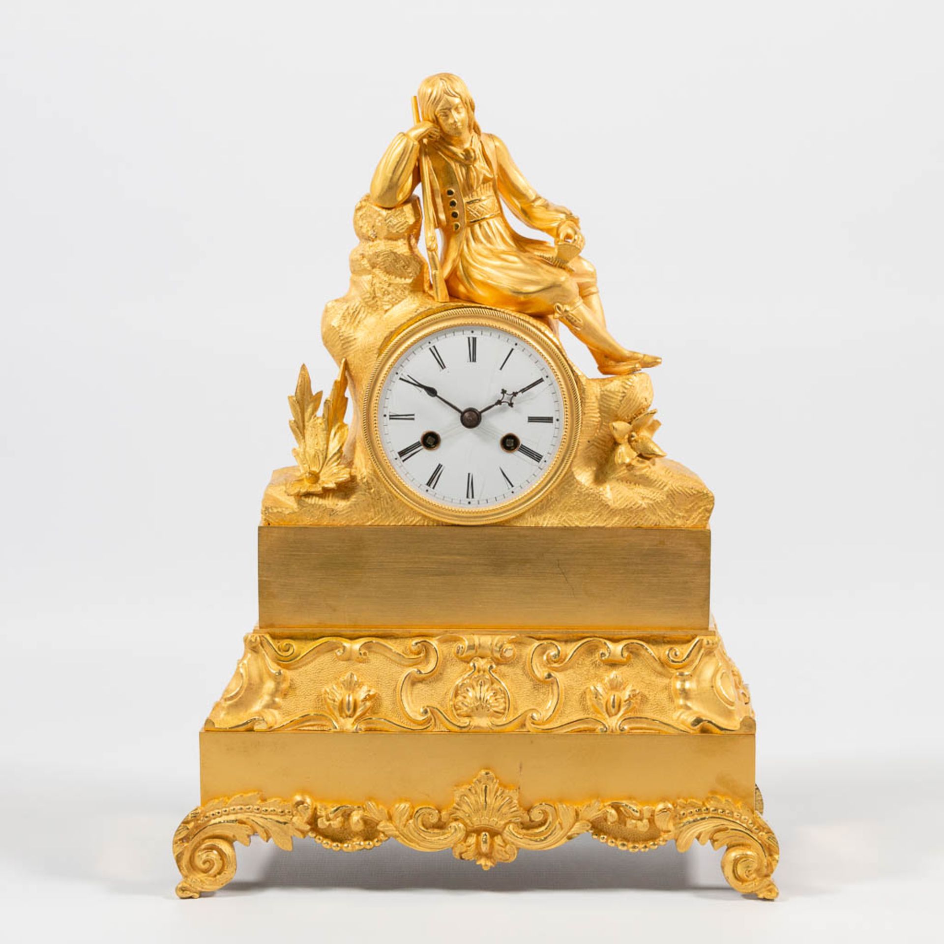 An Ormolu Bronze Clock with Resting Hunter Scene