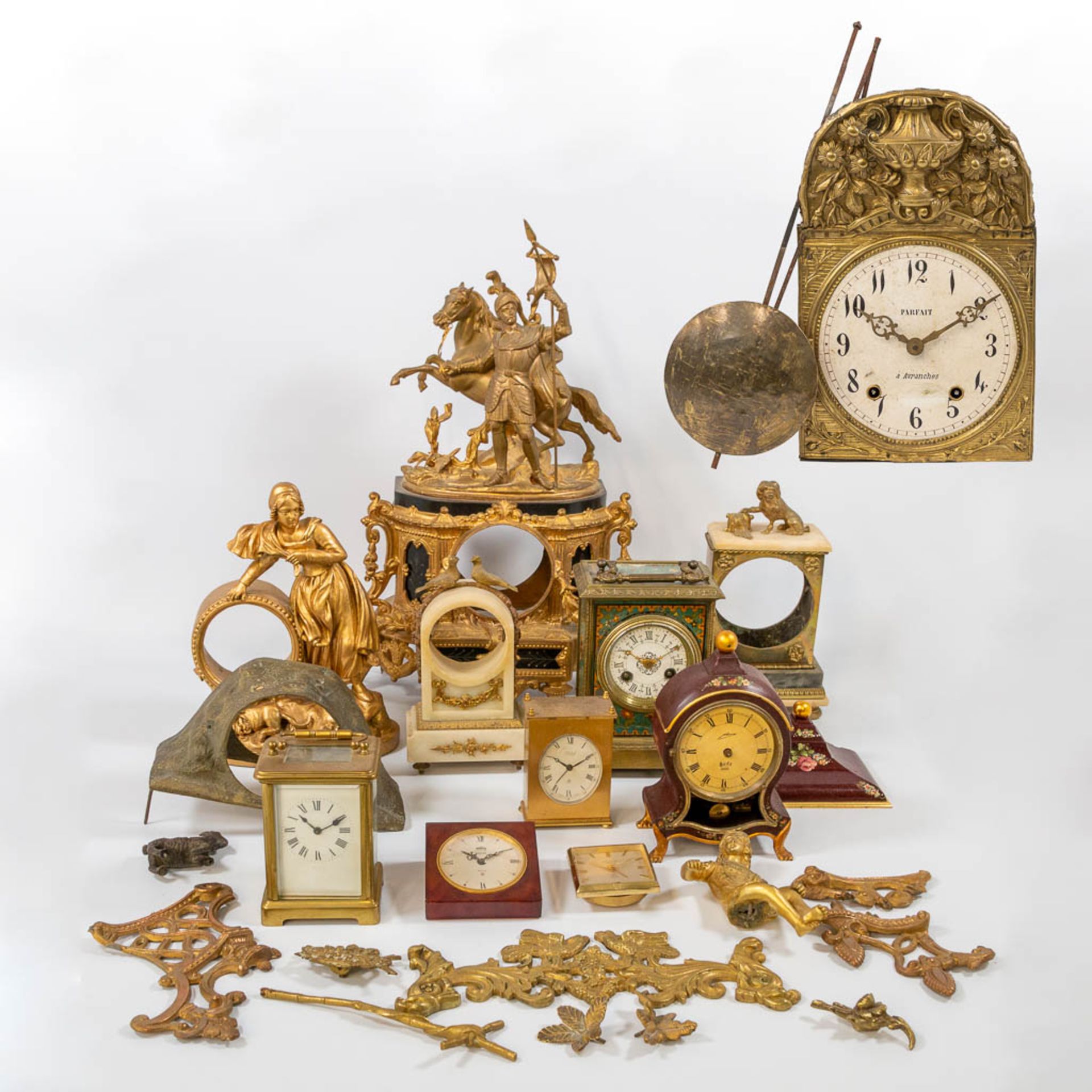 A collection of clocks and parts, a comptoise, an officers clock and table clock marked 'Jaeger Le C
