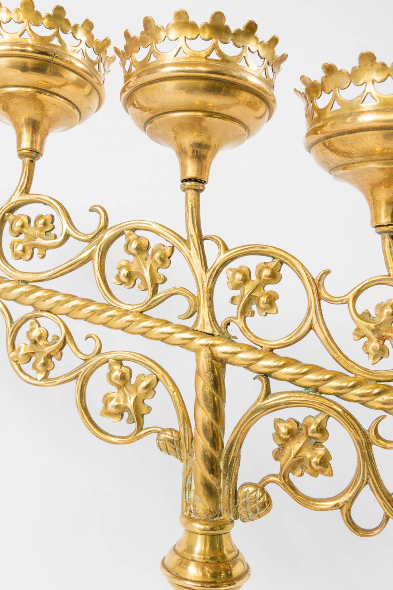 An Antique brass church candelabra, decorated with grape vine leaves and standing on claw feet, Fran - Image 22 of 22