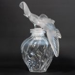 A crystal decanter 'l'air du temps', Nina Ricci, marked Lalique France, with a pair of doves as lid.