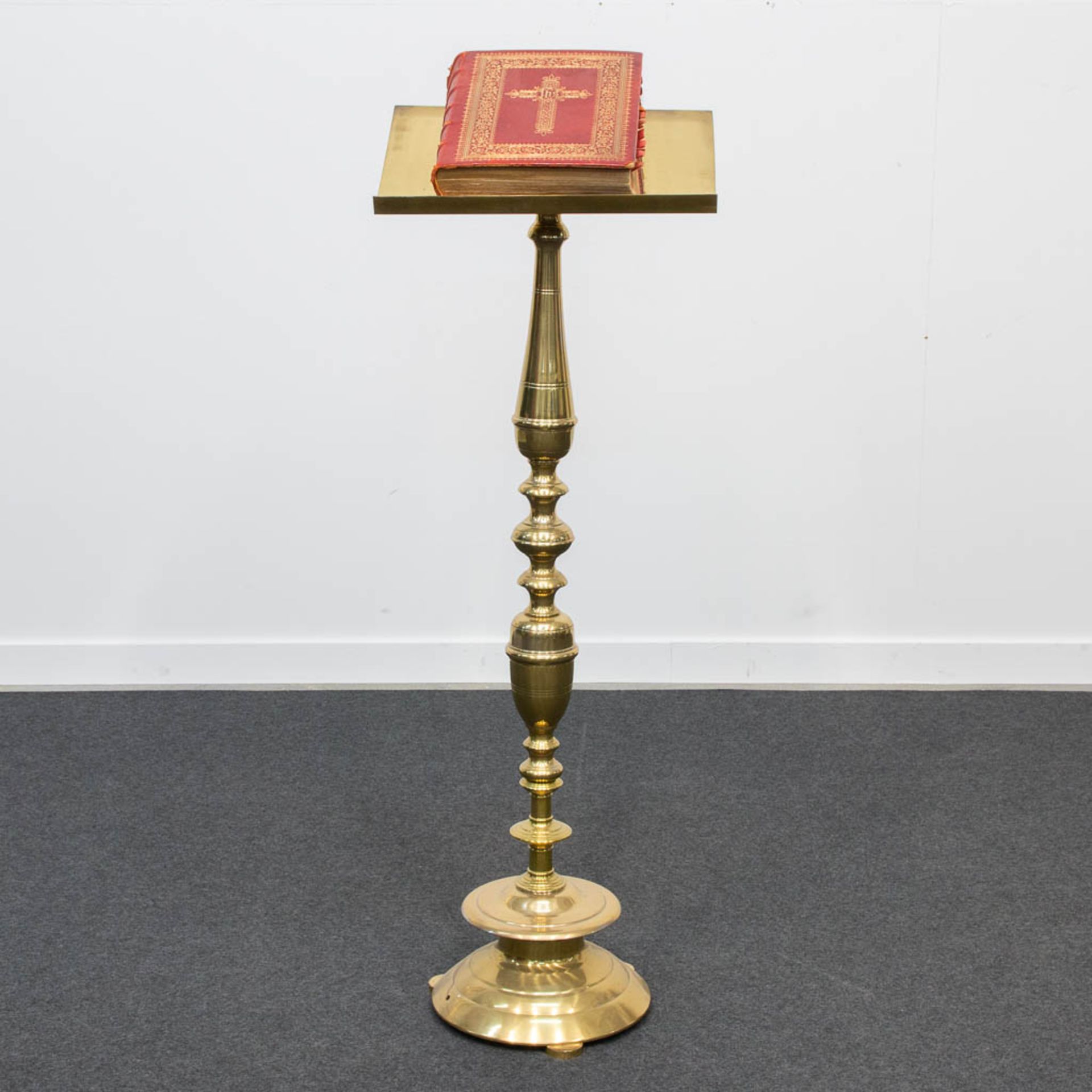 A Bronze standing lectern for church, combined with a Missale Romanum church book.