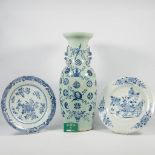 A blue and white Chinese Vase with symbolic decor, combined with 2 blue and white porcelain plates.