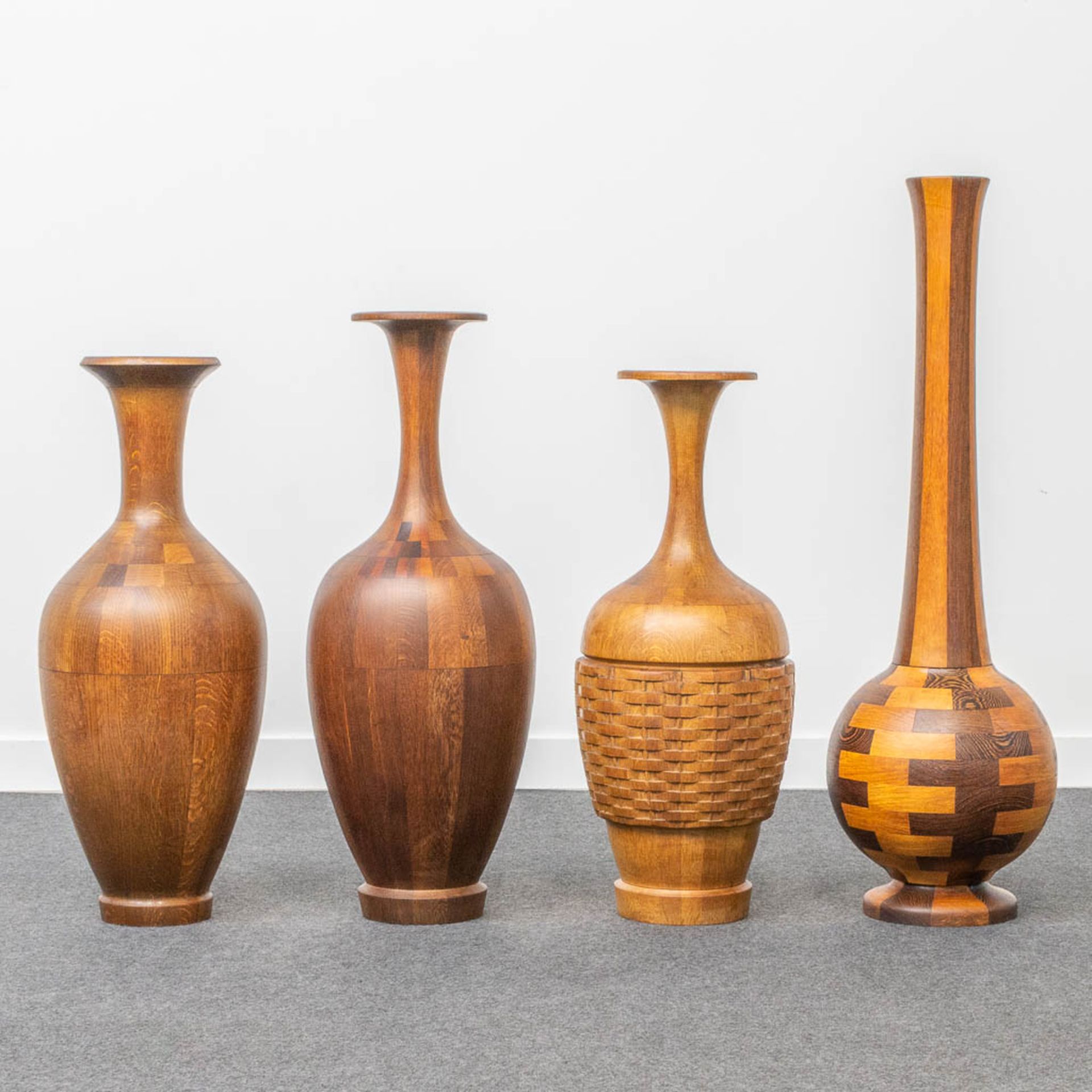 A collection of 4 wood-turned vases with inlay, made by DeCoene in Kortijk, Belgium.