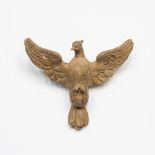 A wood sculpture depicting a bird, patinated, 19th century.