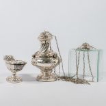 A silver Insence burner and Insence jar.