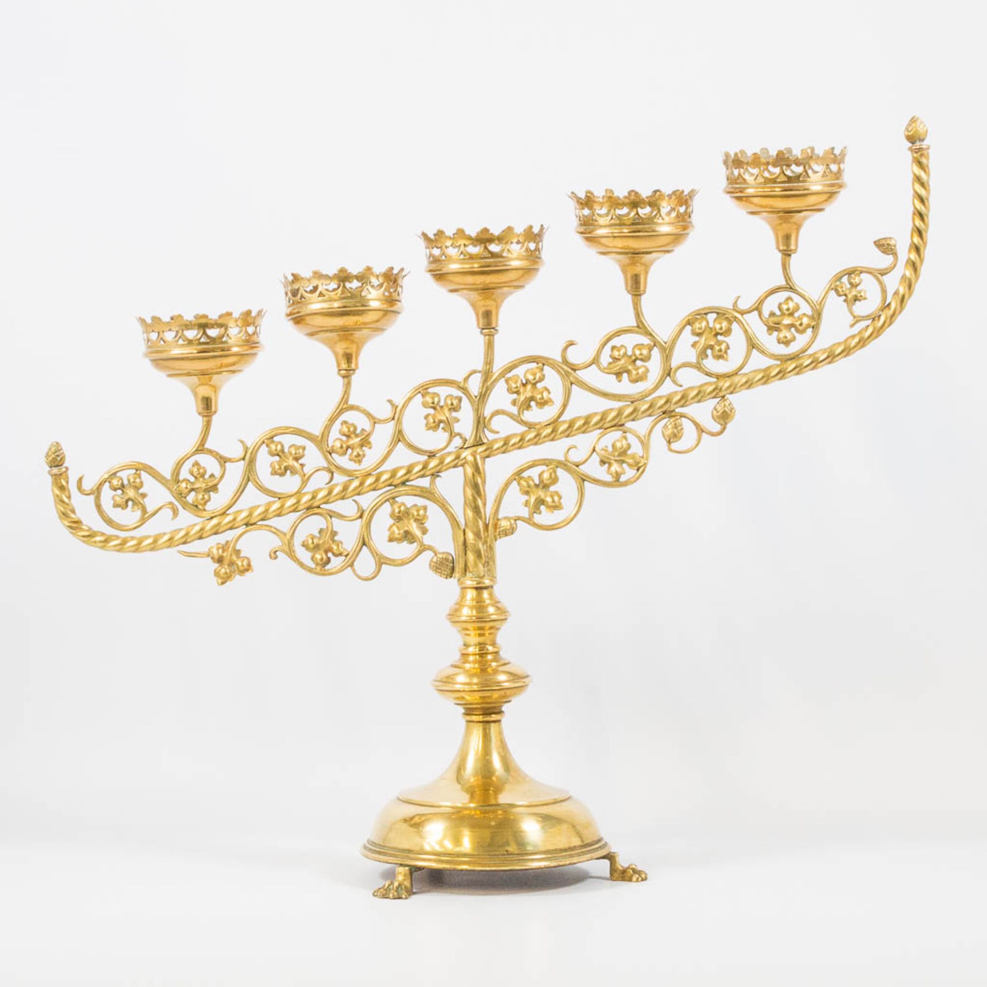An Antique brass church candelabra, decorated with grape vine leaves and standing on claw feet, Fran - Image 12 of 22