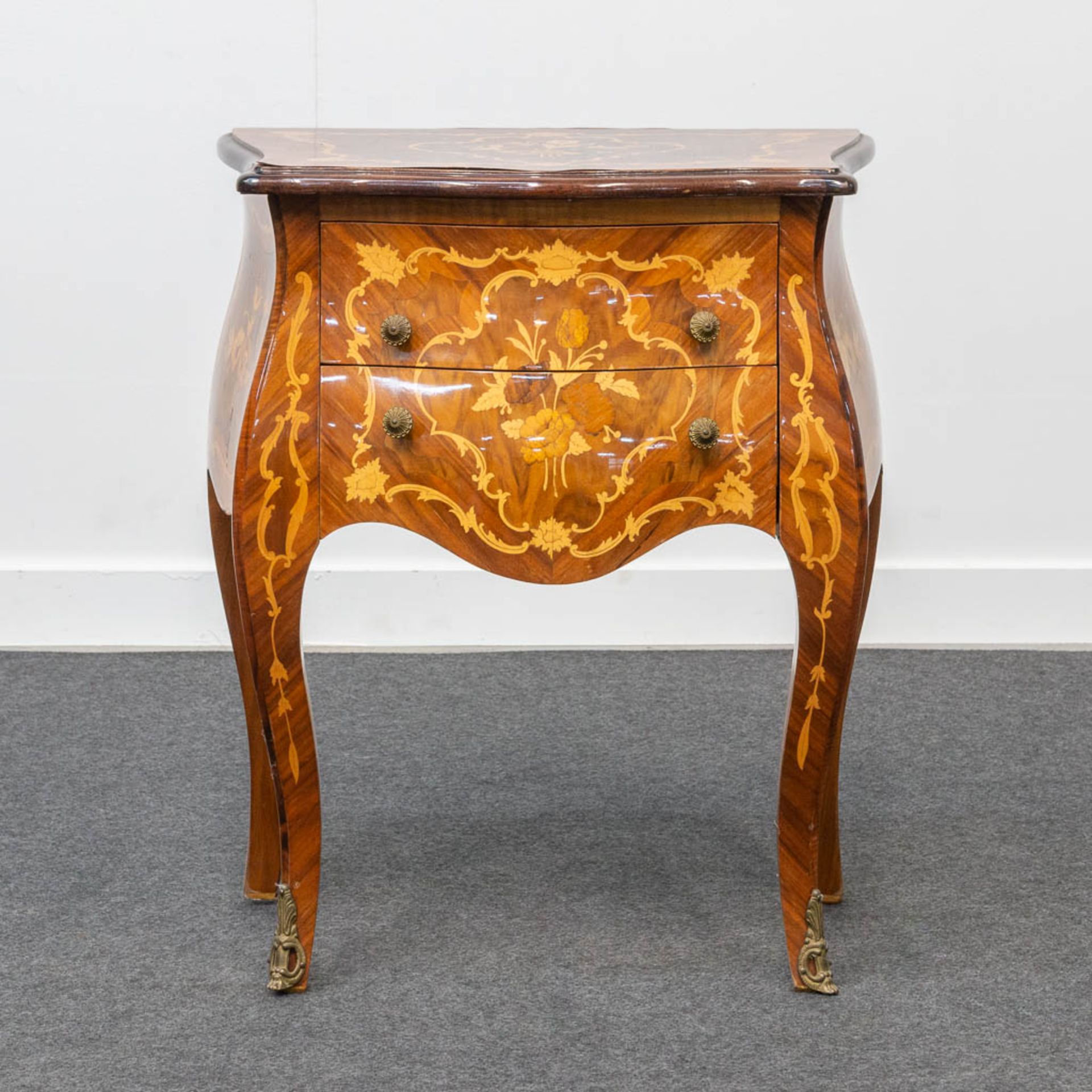 A small two-drawer side cabinet with marquetry inlay.