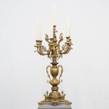 A candelabra, made of bronze with space for 7 candles .