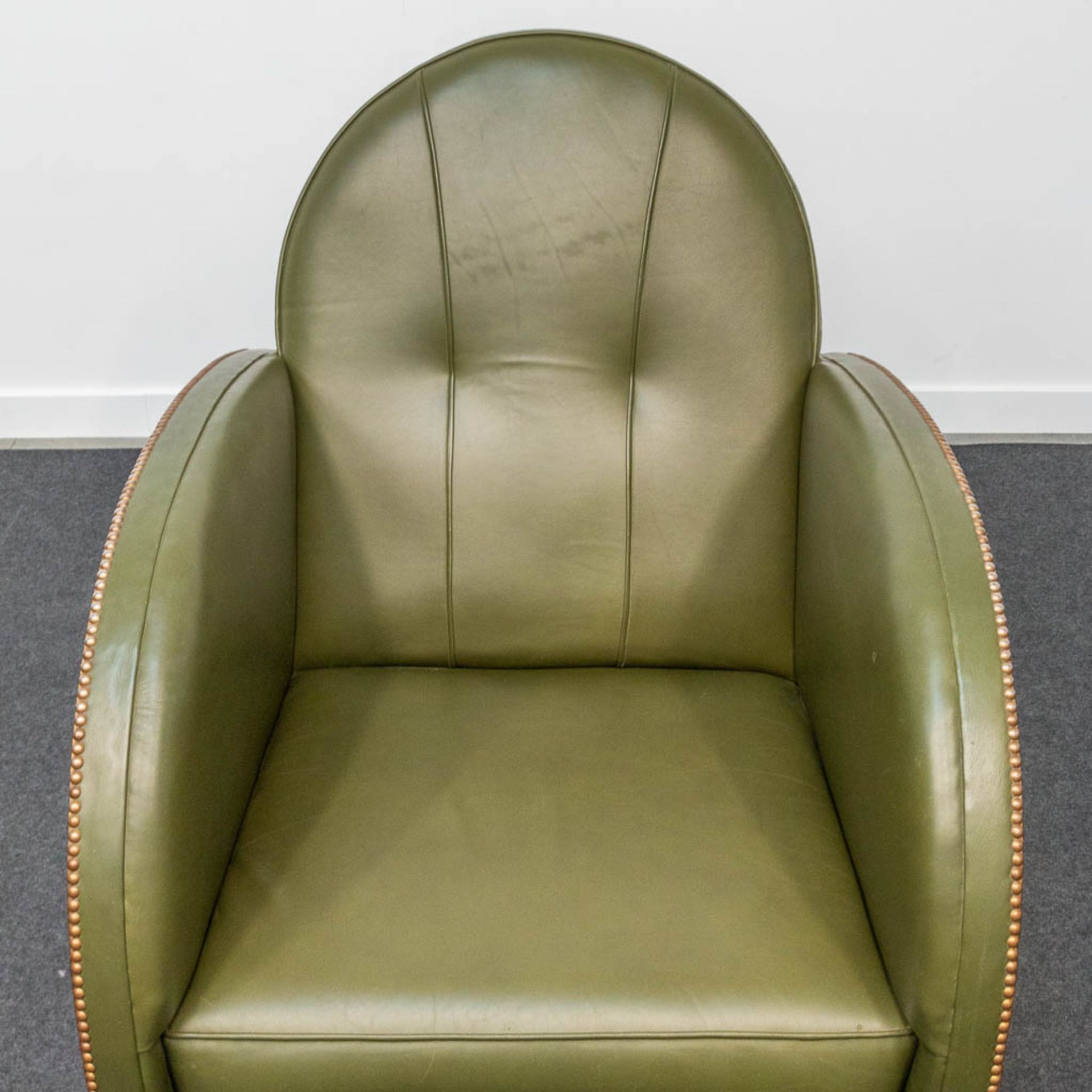 An armchair, upholstered with leather and with wood sides, art deco style. - Image 3 of 20