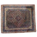 An Oriental, hand-made carpet 250 x 303