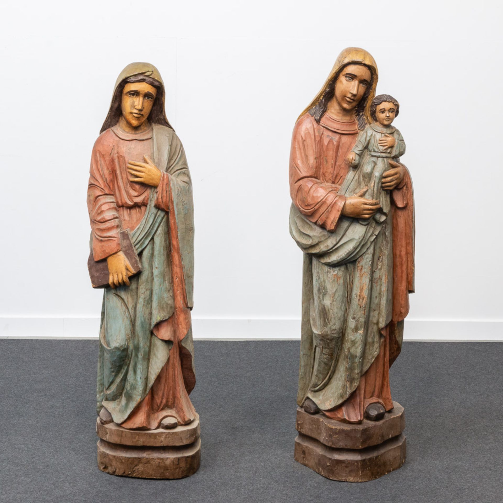 A collection of polychrome wood statues, images of Madonna