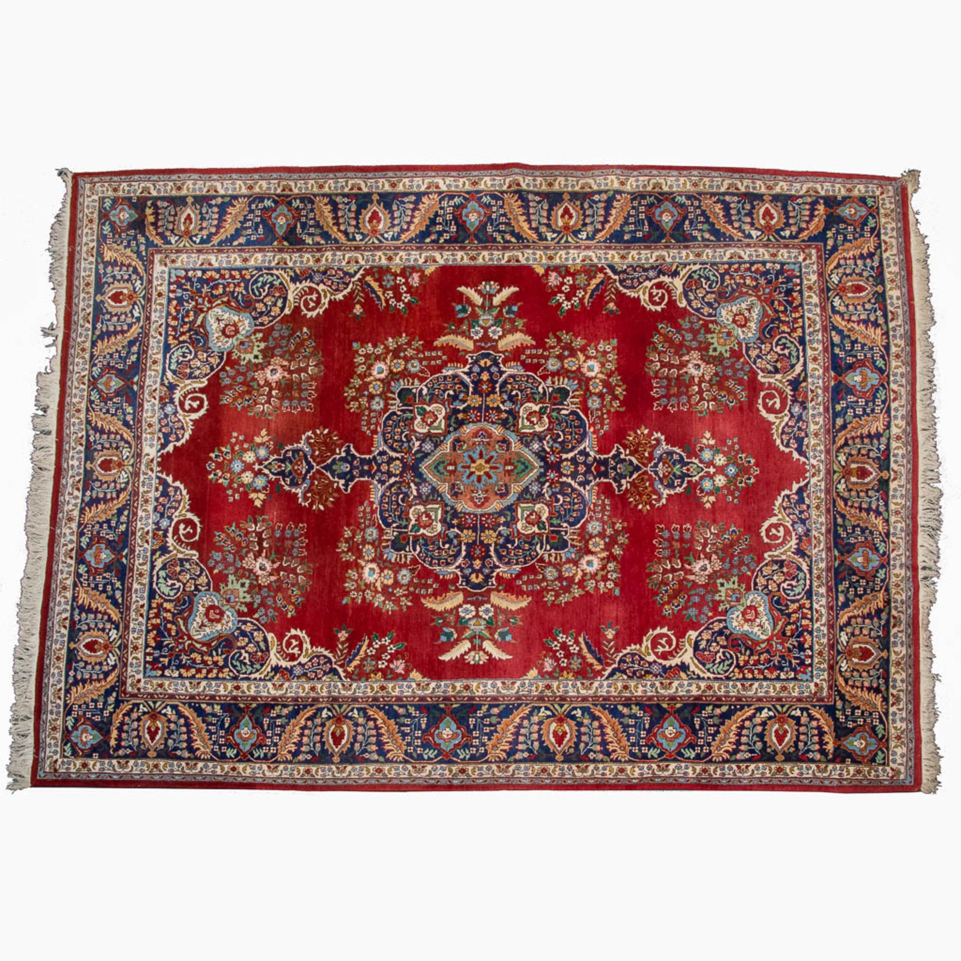 An Oriental, hand-made carpet 348 x 258