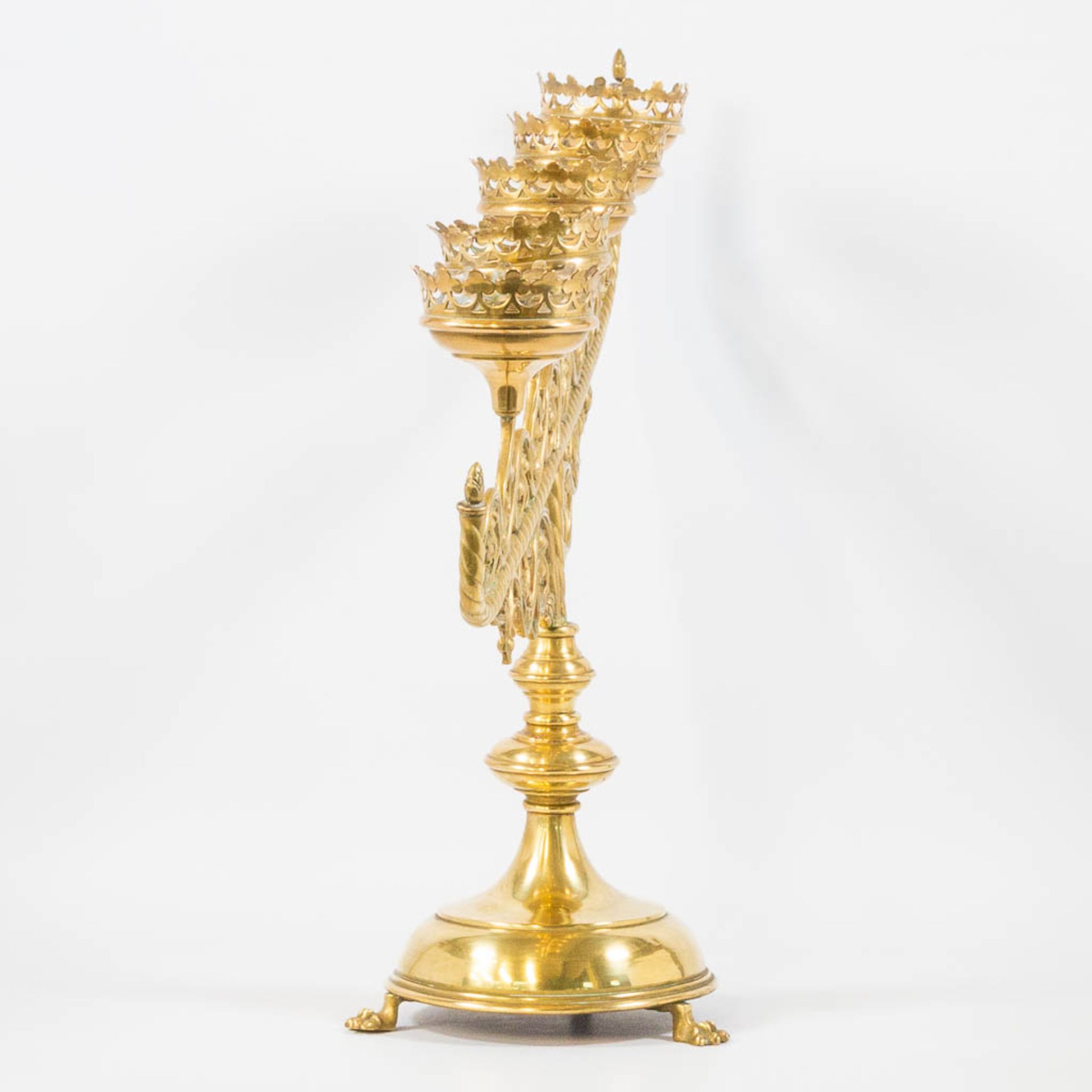 An Antique brass church candelabra, decorated with grape vine leaves and standing on claw feet, Fran - Image 3 of 22