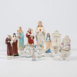 A collection of 11 bisque porcelain holy statues, Mary, Joseph, and Madonna.