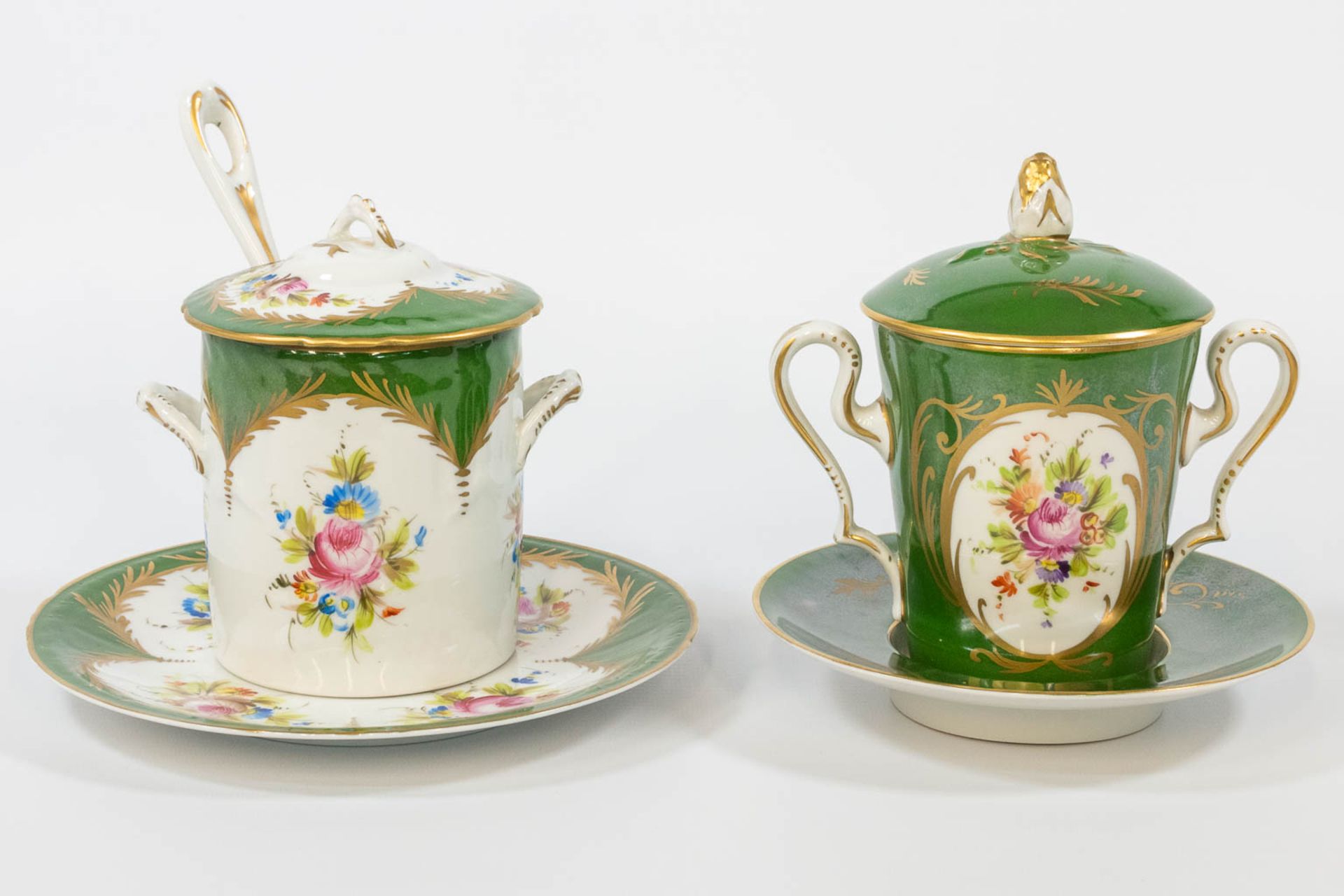 A tremble cup and sugarpot, made of hand-painted porcelain with a flower decor and marked JD Limoges