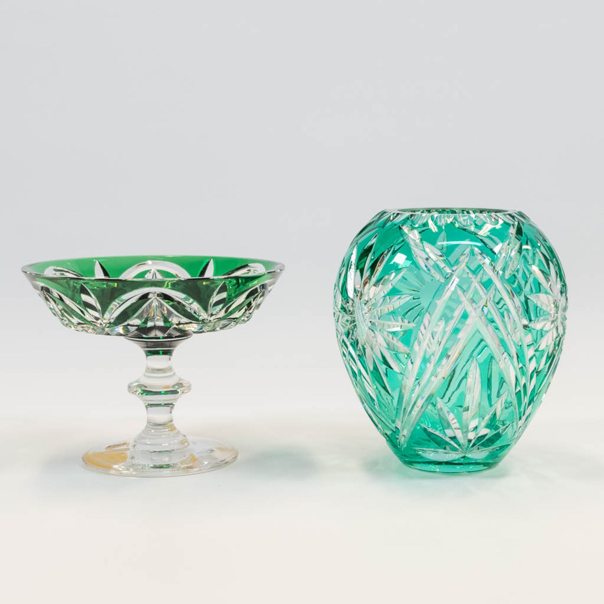 A collection of a Tazza and a flower vase in cut crystal 1 made by Val Saint Lambert and 1 made prob