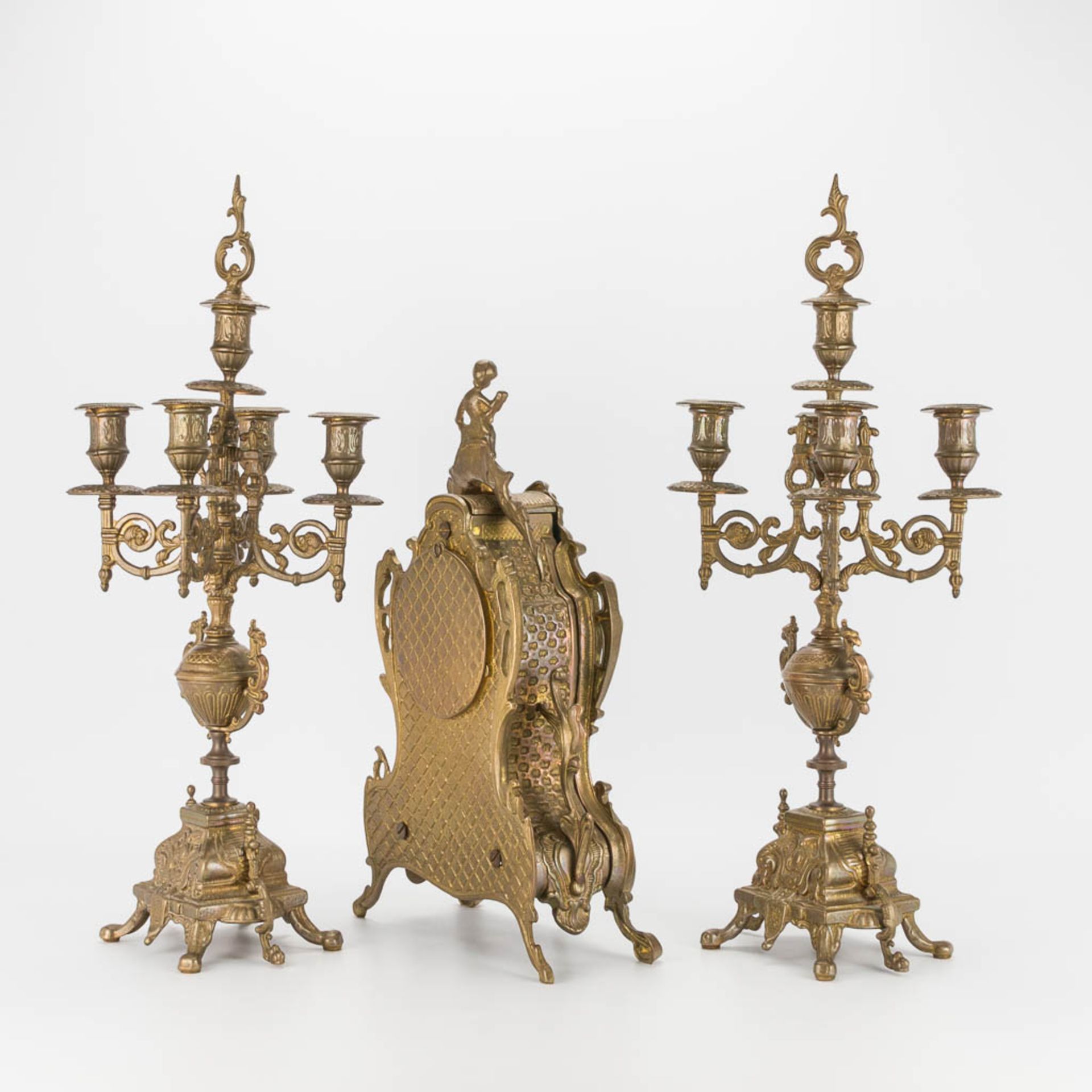 A bronze 3-piece garniture with clock and candelabra. The second half of the 20th century. (22 x 22 - Image 7 of 16