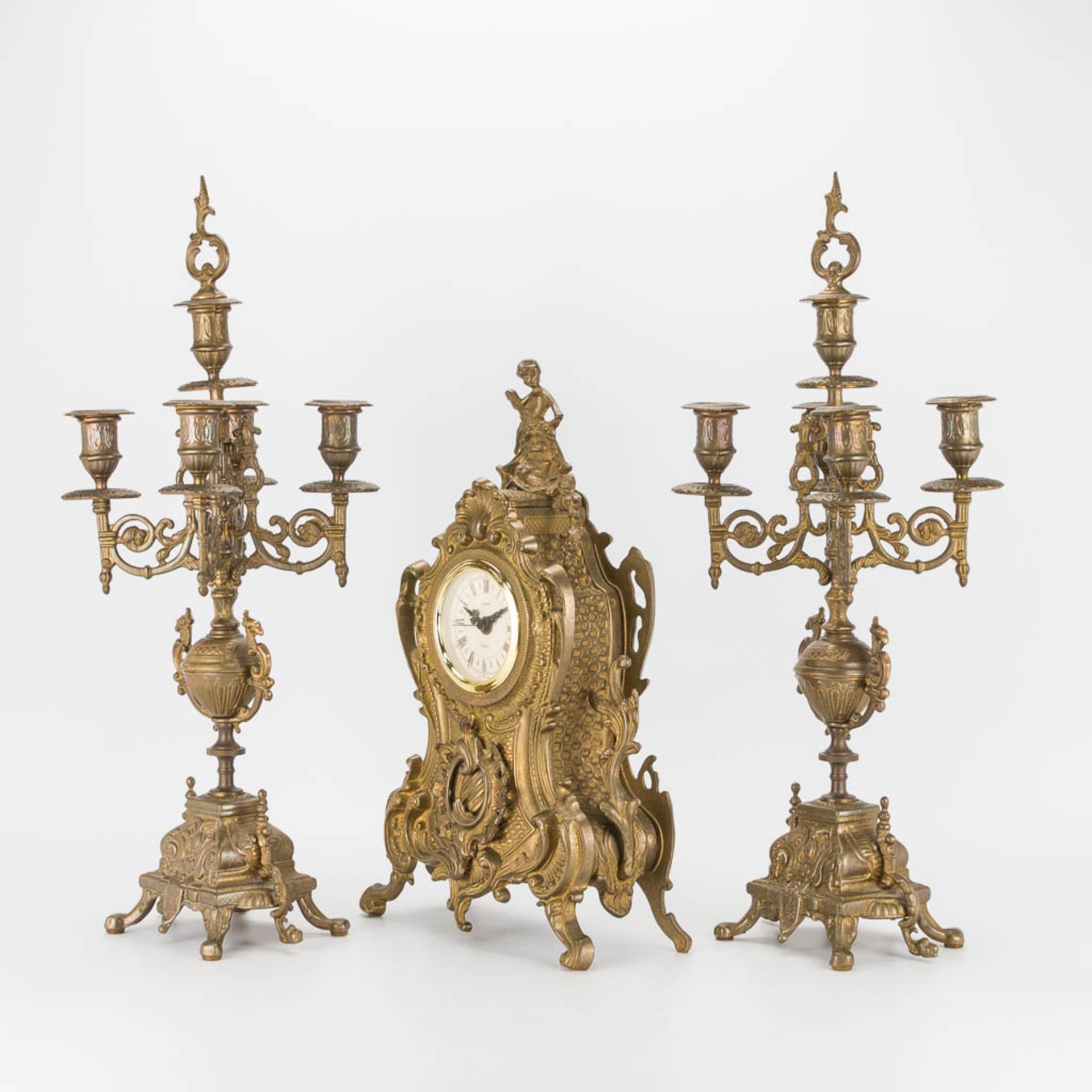 A bronze 3-piece garniture with clock and candelabra. The second half of the 20th century. (22 x 22 - Image 5 of 16