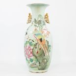 A Chinese vase with decor of a crane and peacock, richly decorated with flowers. 19th century. (57 x