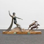 J. DAUVERGNE (XIX-XX) Diana the huntress chasing antilopes. An art deco style bronze statue on a mar