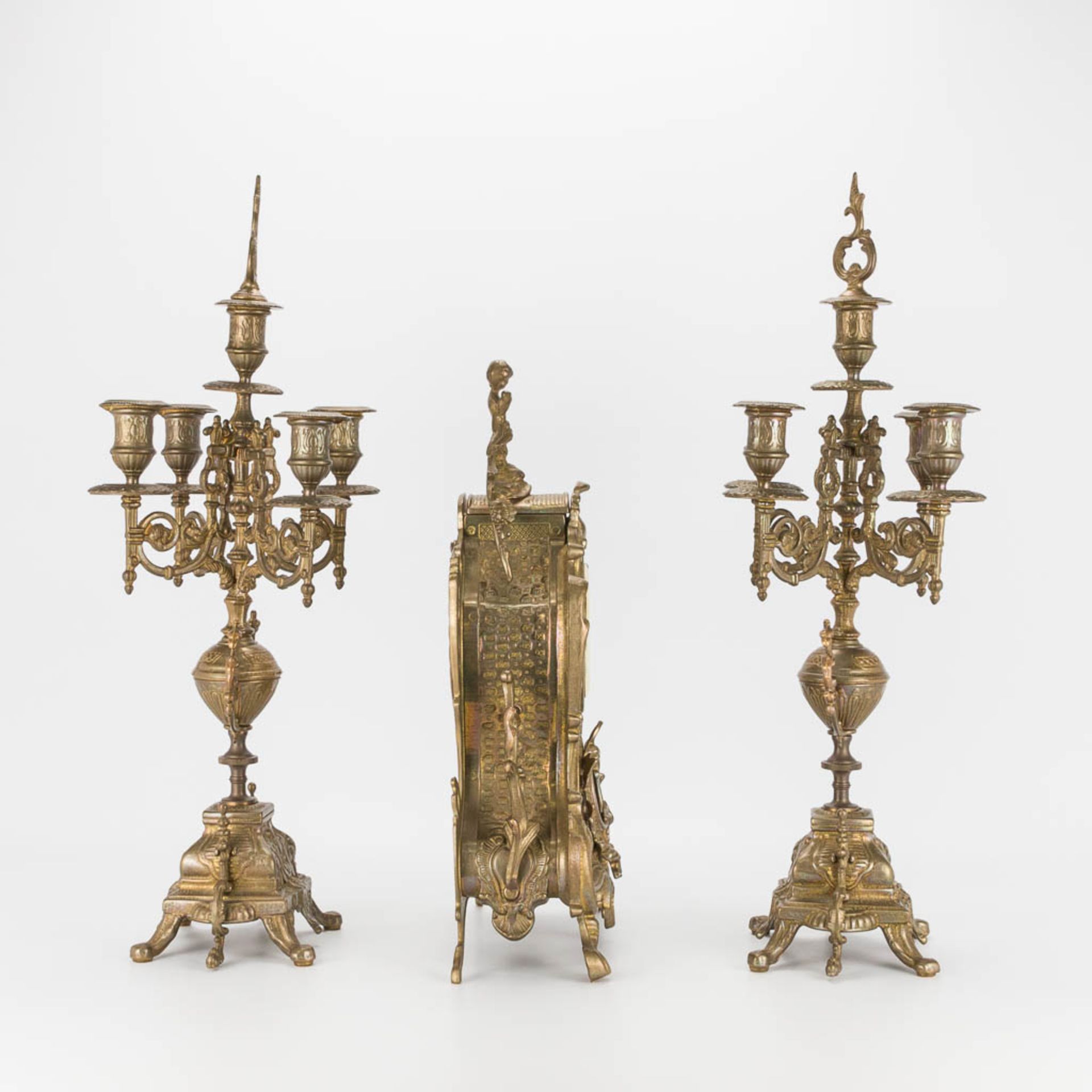 A bronze 3-piece garniture with clock and candelabra. The second half of the 20th century. (22 x 22 - Image 3 of 16