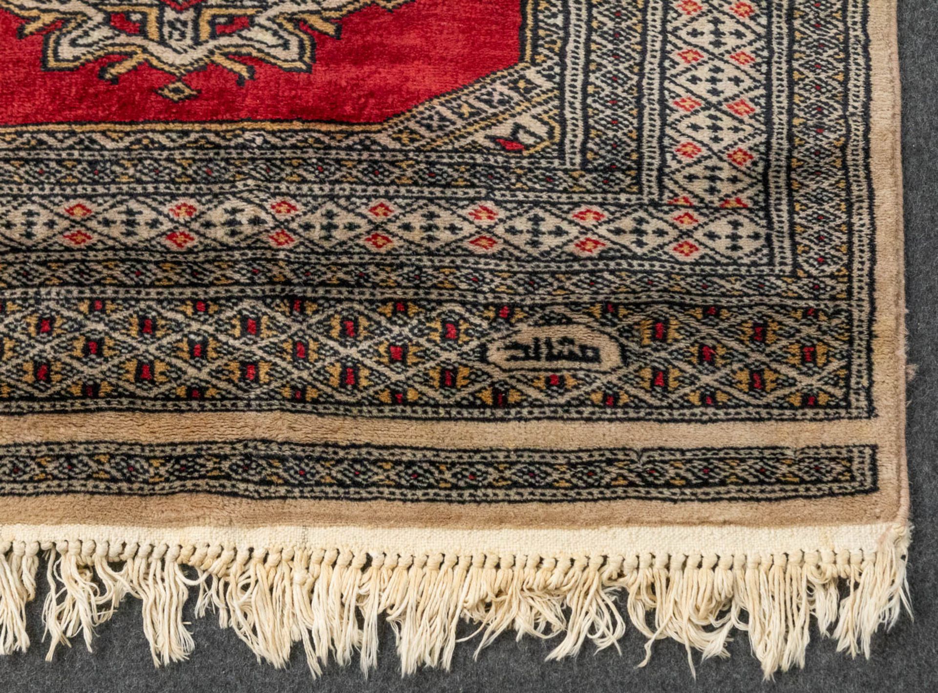 An Oriental hand-made runner carpet Bokhara (285 x 79 cm). - Image 2 of 7