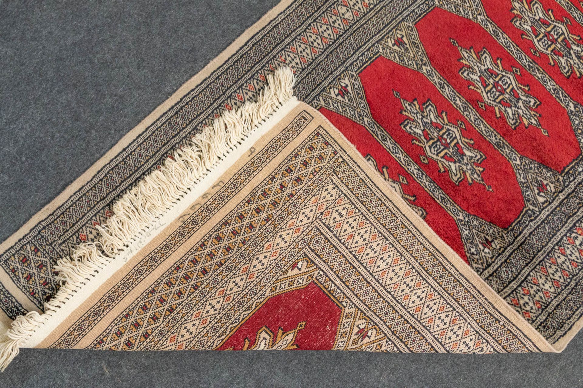 An Oriental hand-made runner carpet Bokhara (285 x 79 cm). - Image 7 of 7