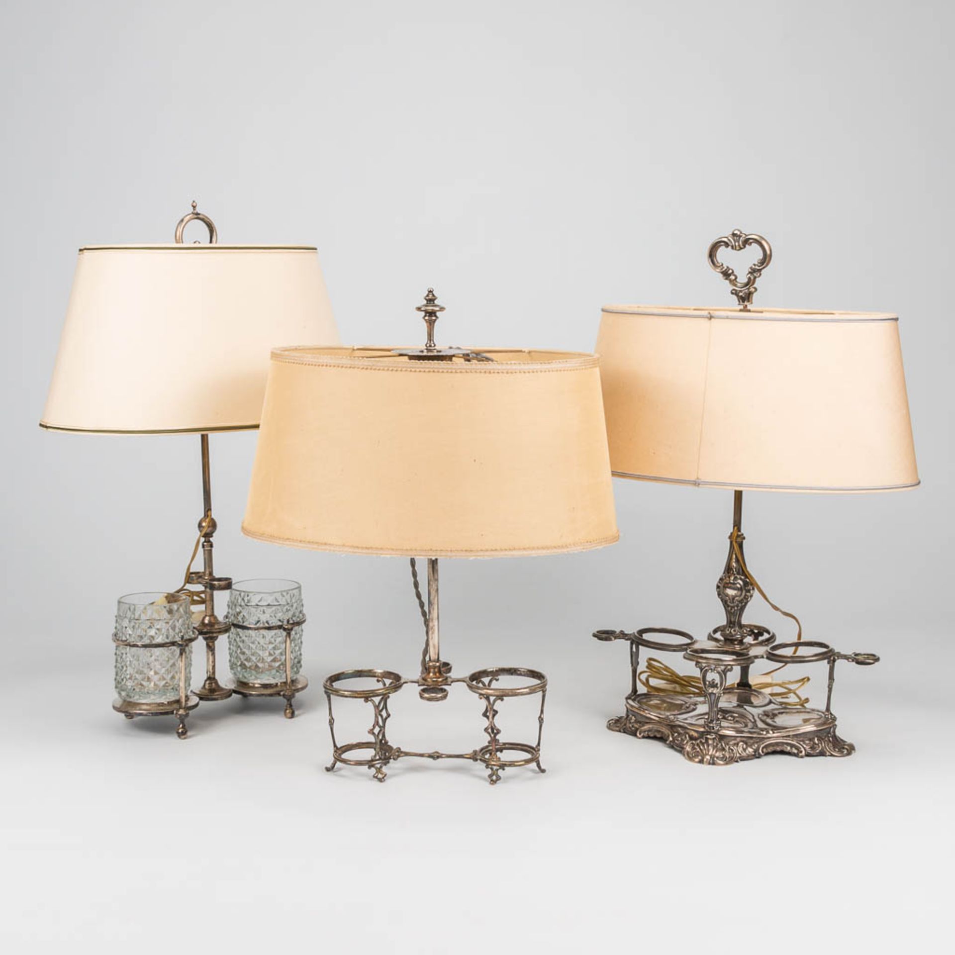 A collection of 2 silver and 1 silver-plated oil and vinegar set, of which table lamps were made. (7