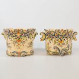A collection of 2 of cache-pots in two sizes with hand-painted decor, made of faience in Rouen, Fran