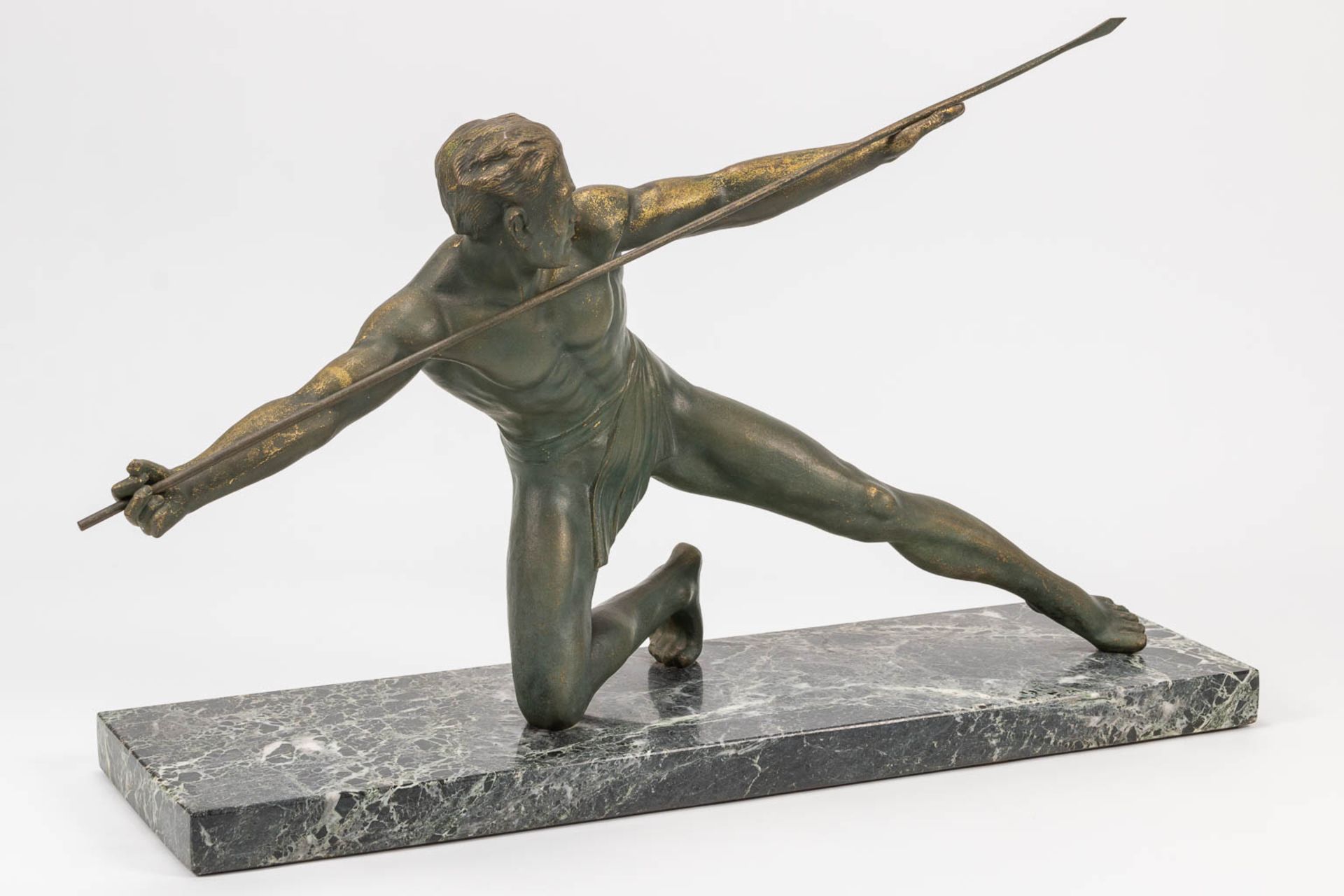 A bronze statue of a spear thrower in art deco style and standing on a marble base. The first half o - Bild 7 aus 13