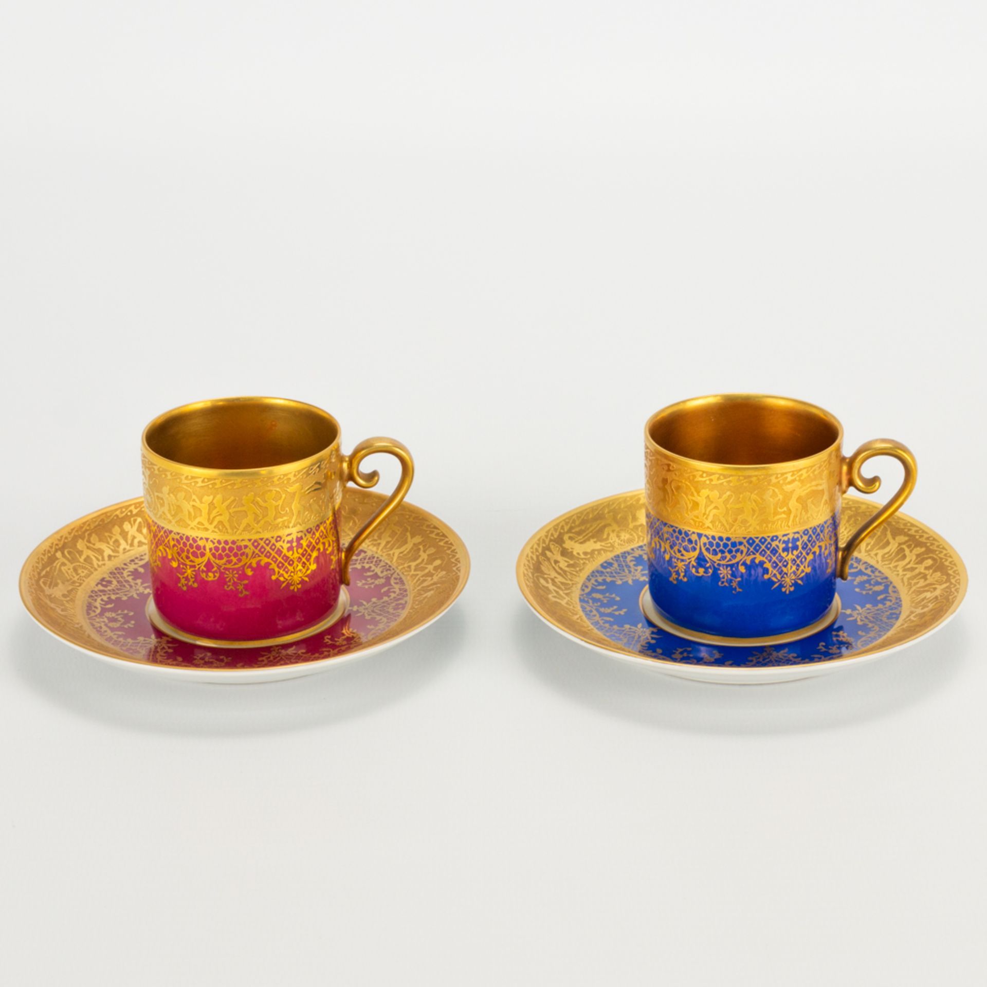 A collection of 2 coffee cups and saucers, made by Karlsbader Porzellan in Germany and inlayed with
