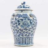 A blue and white Chinese vase with lid, decorated with foo dogs and flowers. 18th-19th century. . (3
