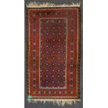 An Eastern hand-made carpet. (114 x 195 cm).