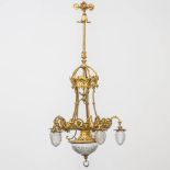 A large bronze chandelier with cut glass. Made around 1900. (80 x 80 x 116 cm)