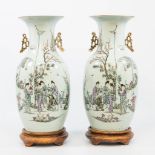 A pair of Chinese vases with decor of ladies and caligraphic texts, 19th/20ste century. (42 x 20 cm)