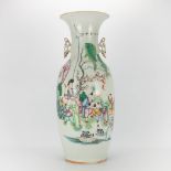 A Chinese vase with decor of a lady and playing children. 19th-20th century. (58,5 x 23 cm)