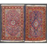 A collection of 2 hand-made wool carpets marked Malayer. (71 x 101 cm) (71 x 101 cm).