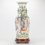 A Chinese porcelain vase with decor of playing children, 19th century. (25 x 60 cm)